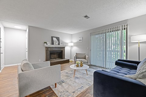 a living room with grey walls and a fireplace